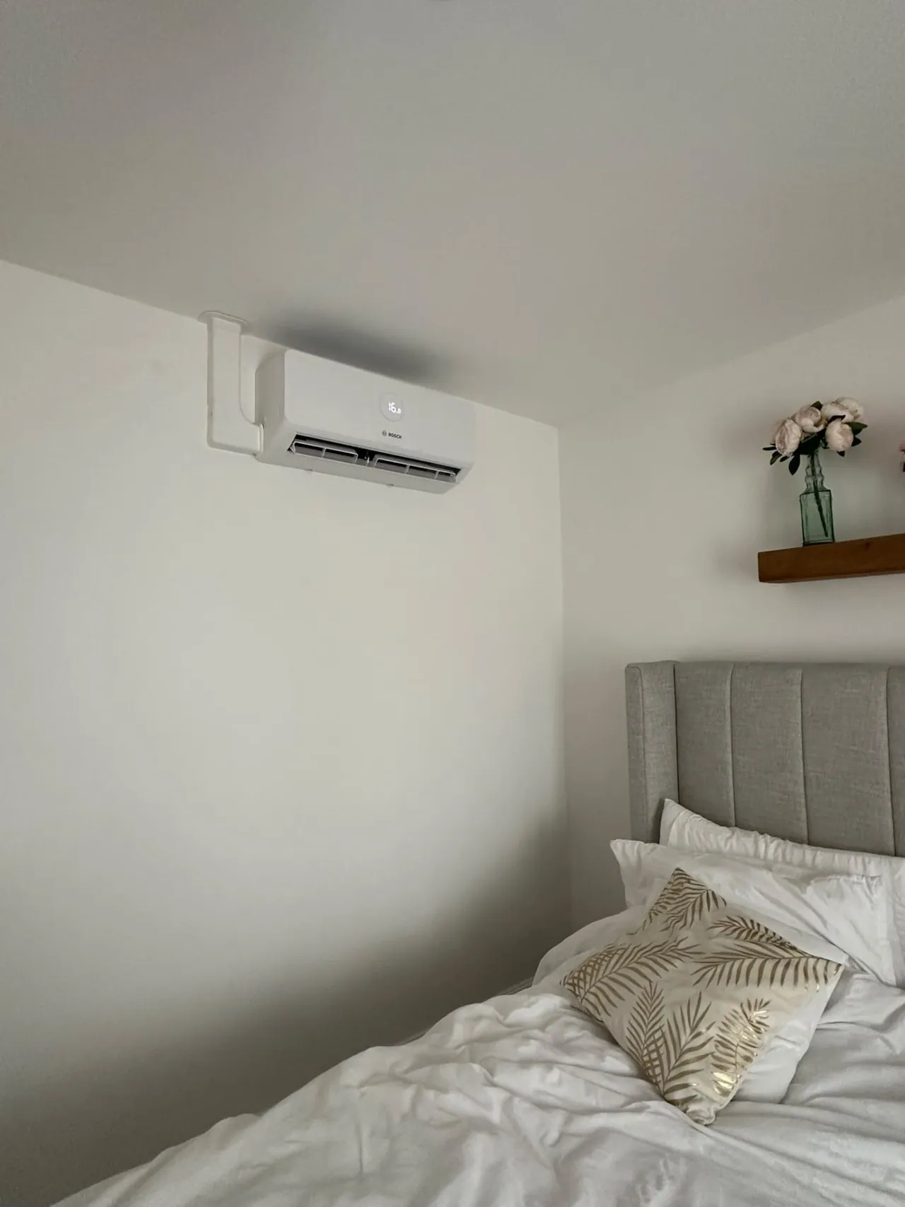 Bosch wall-mounted air conditioning above a bed