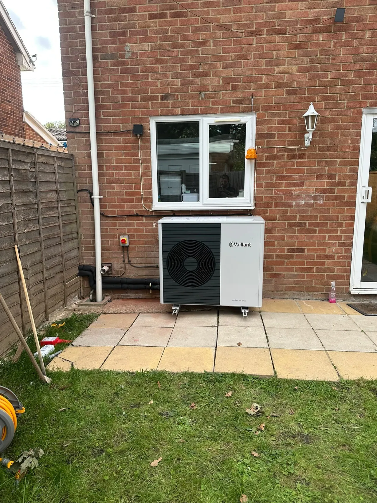 Vaillant air source heat pump outdoor unit on a rear wall