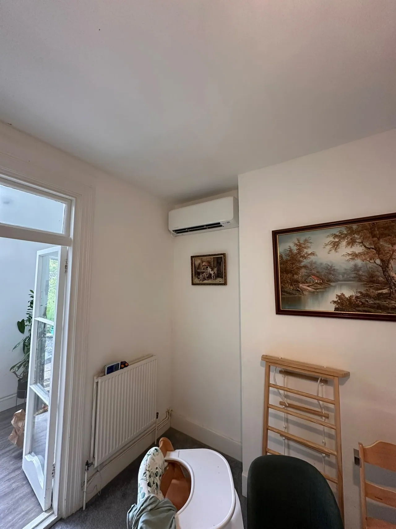 Wall-mounted air conditioning unit installed in a dining room