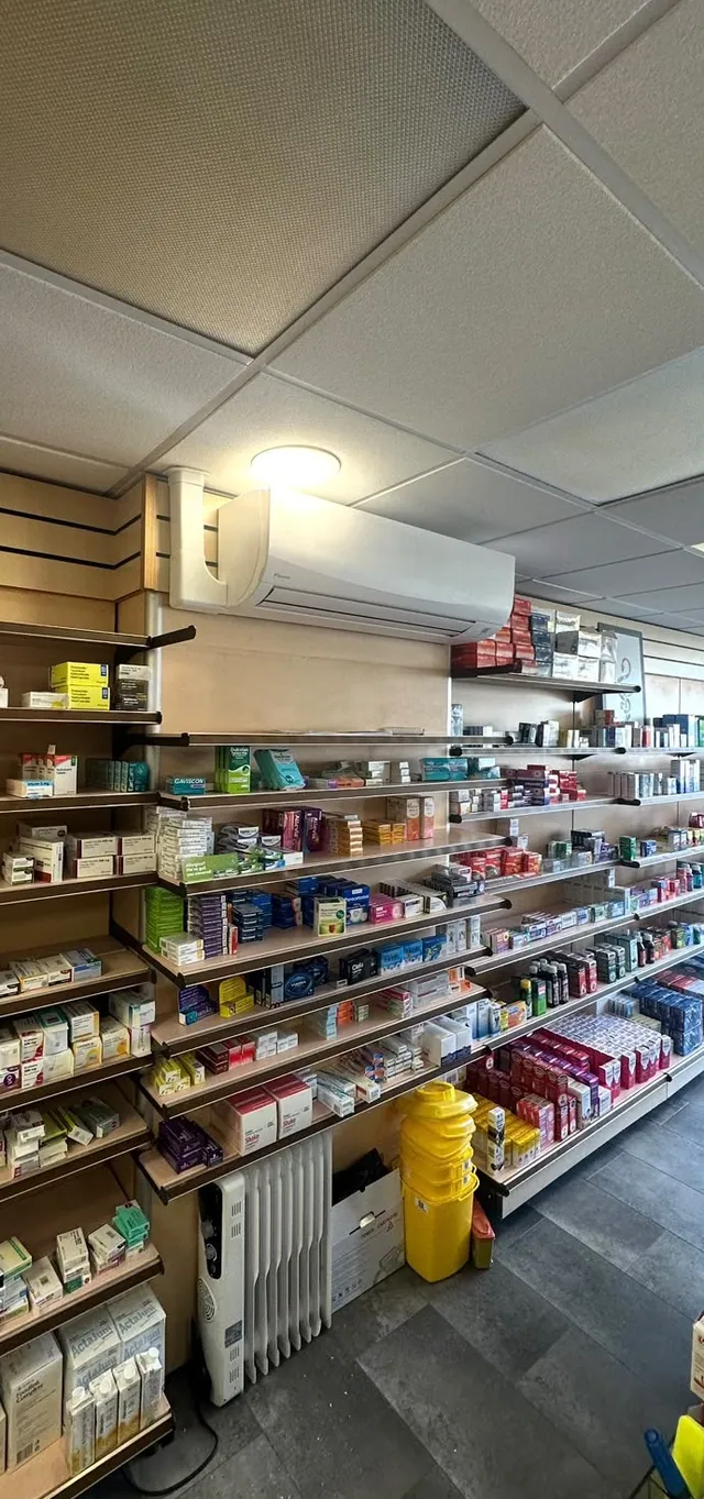 Wall-mounted air conditioning unit installed in a shop