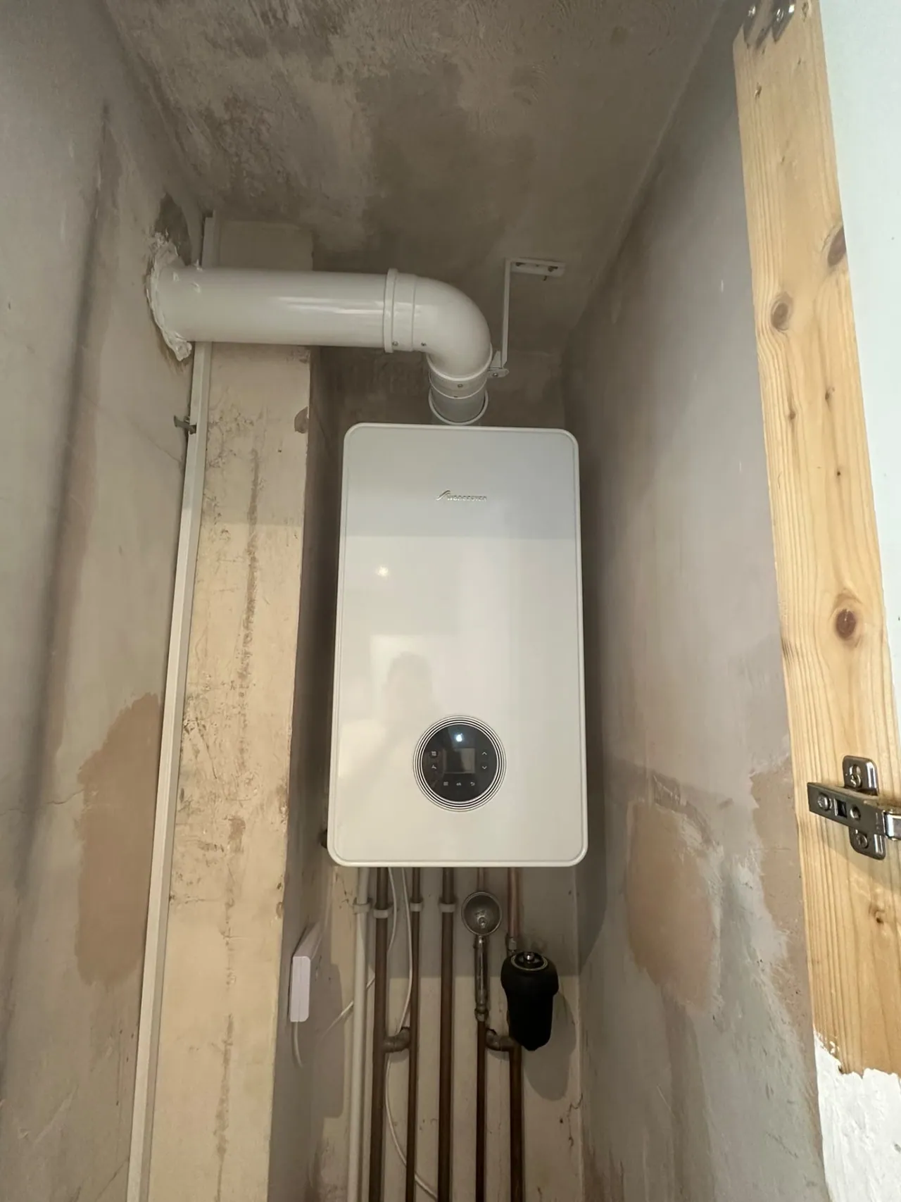 New boiler installation with flue in a cupboard