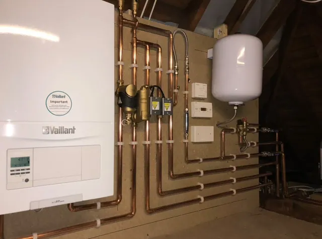 Vaillant boiler installation with copper pipework in a loft