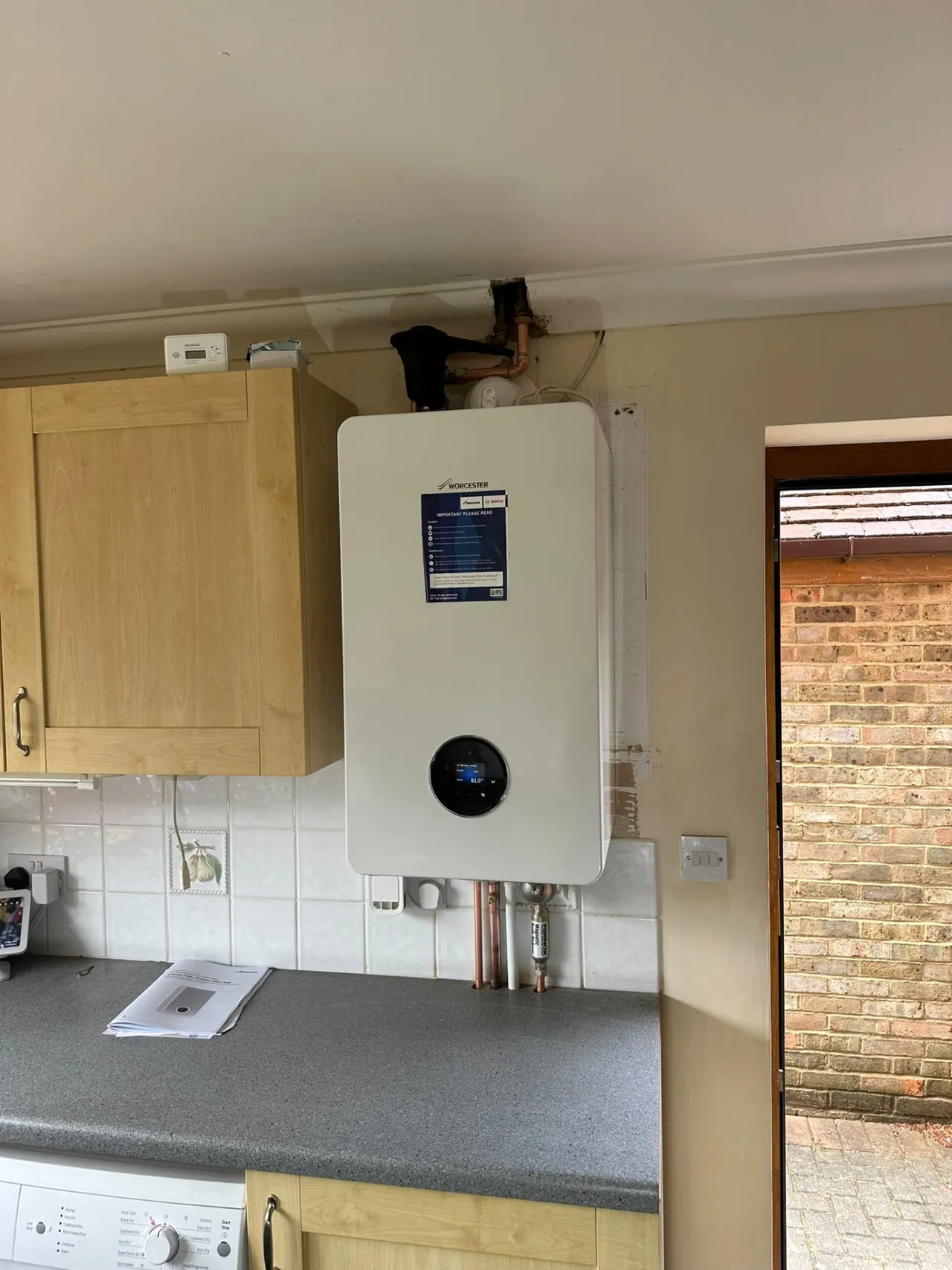 Worcester Bosch boiler installation above a kitchen worktop