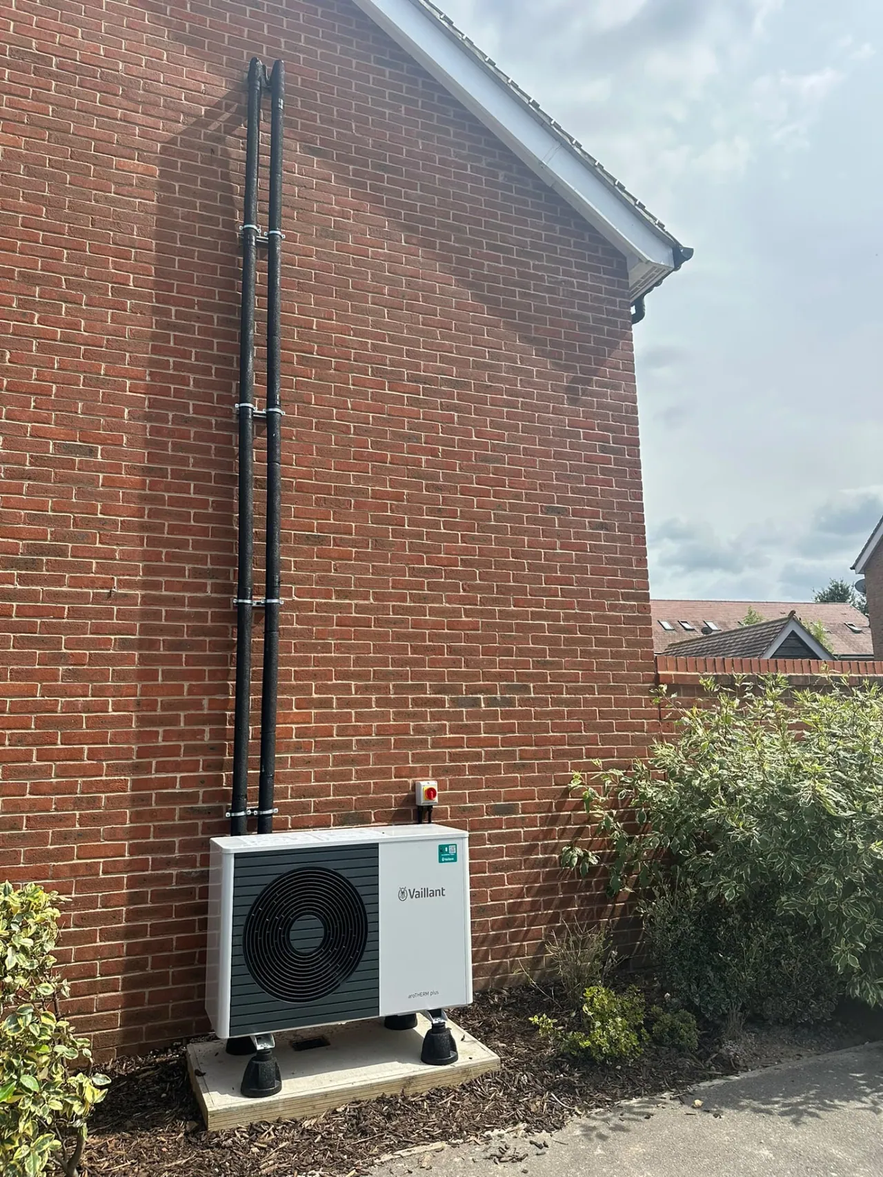 Vaillant air source heat pump outdoor unit with insulated pipework