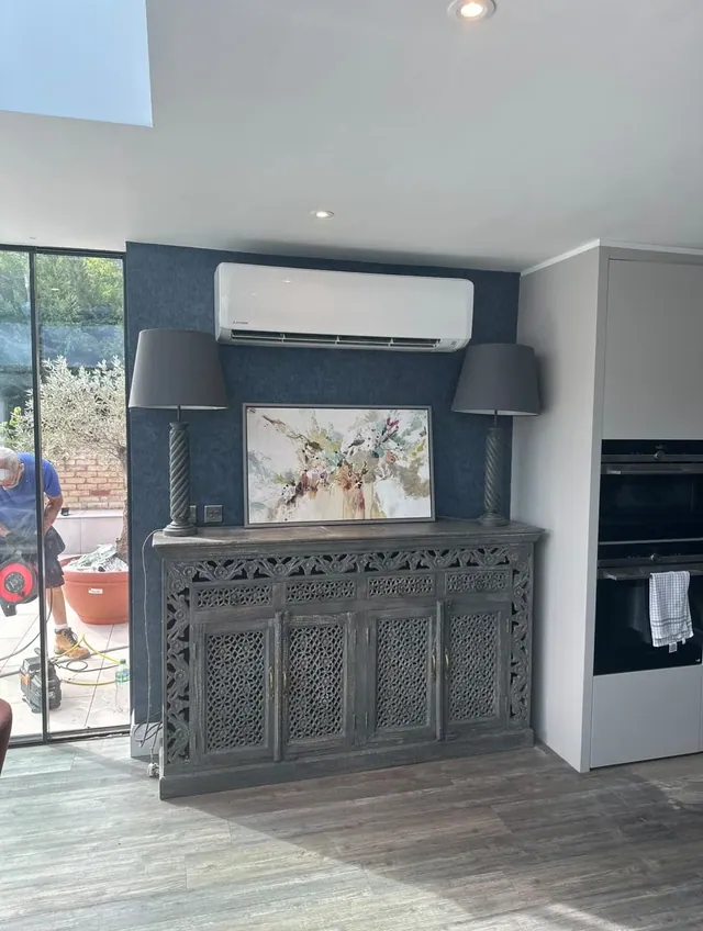 Wall-mounted air conditioning unit installed in an open-plan living room