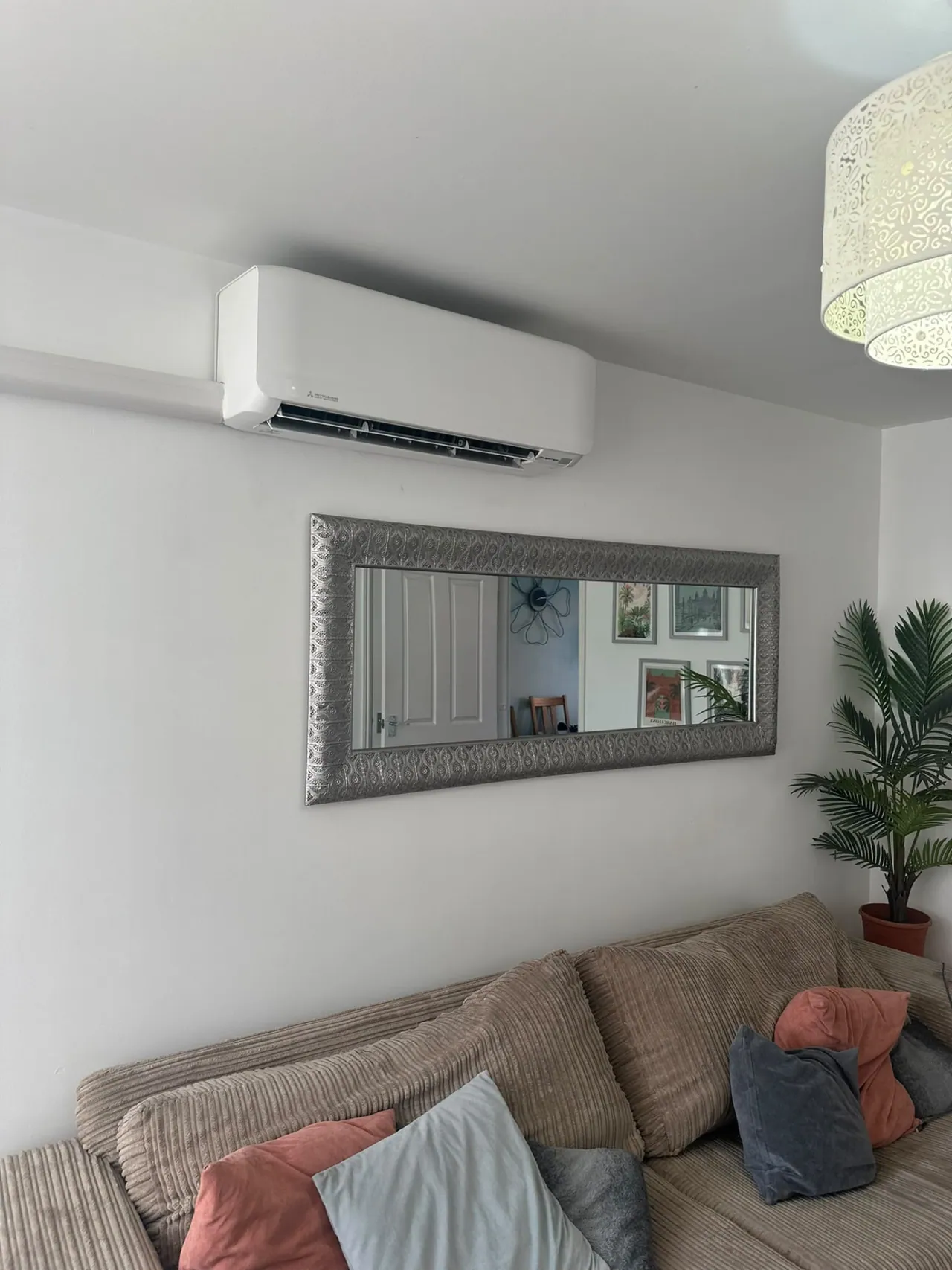 Wall-mounted air conditioning unit installed in a living room