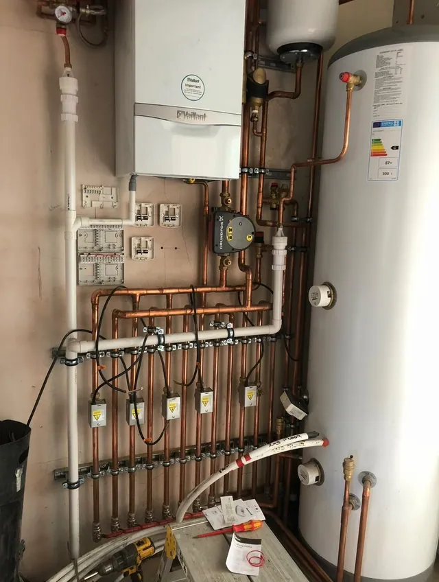 Vaillant boiler and hot water cylinder installation with copper pipework
