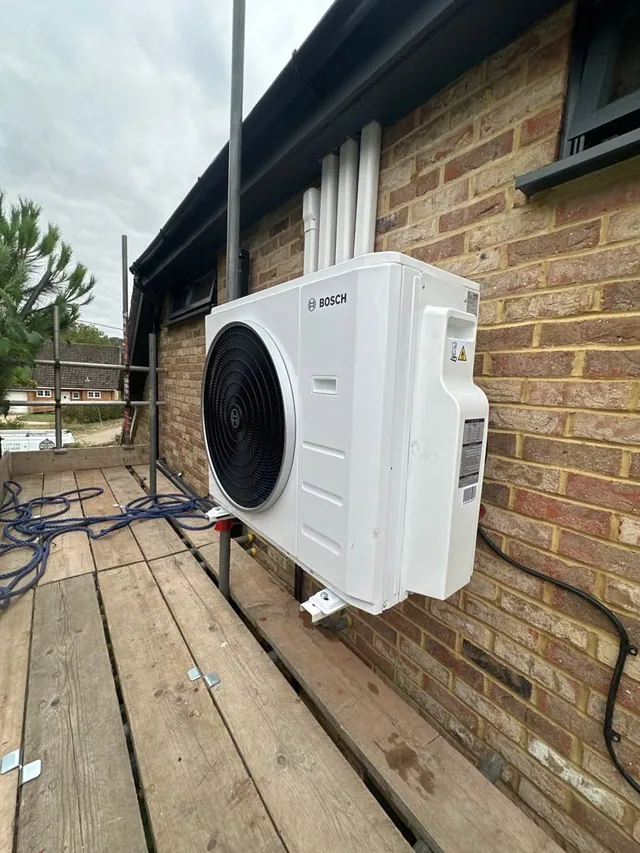 Bosch air conditioning outdoor condenser installed on a raised timber platform