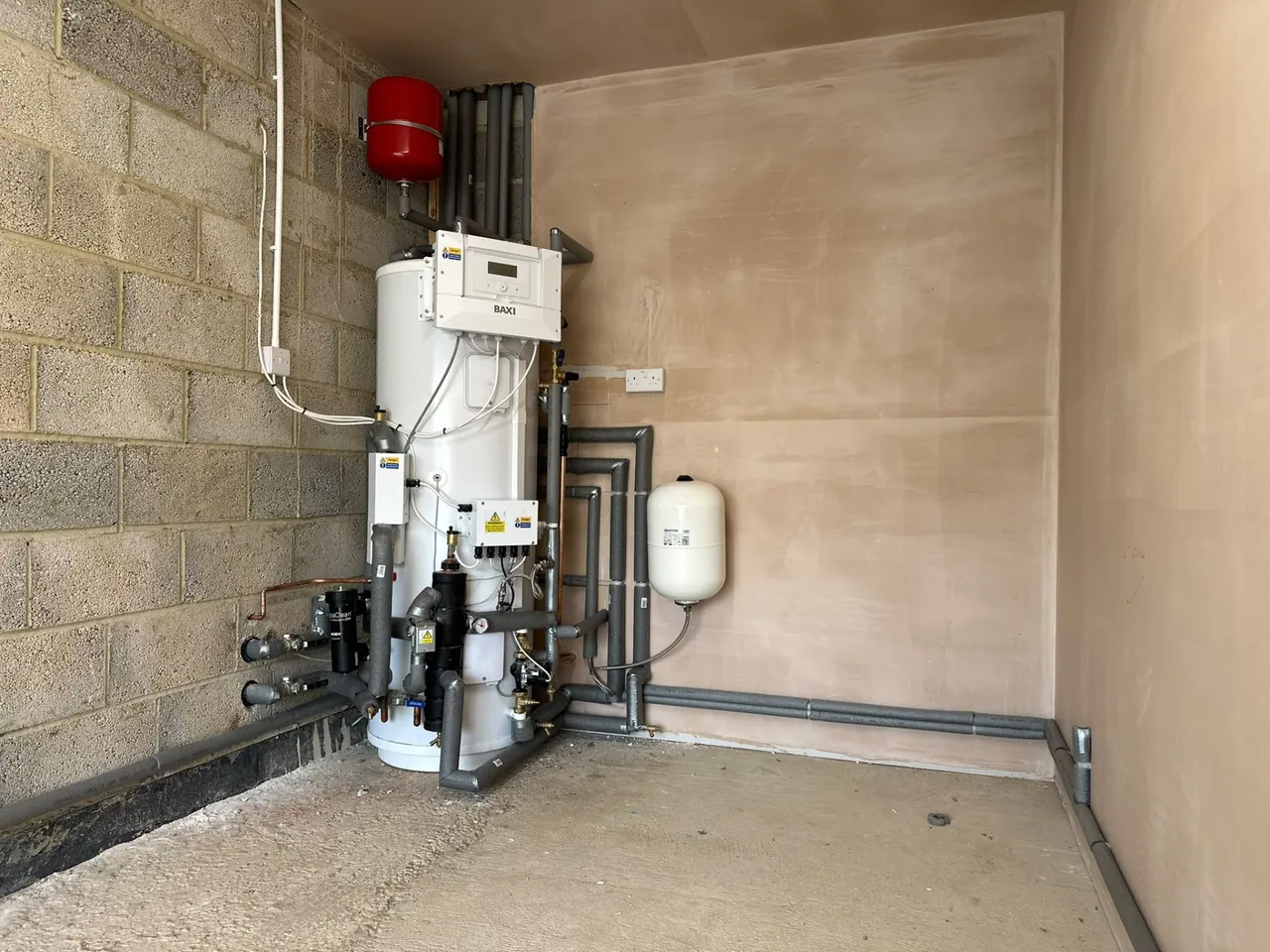 Baxi air source heat pump cylinder and pipework in a plant room