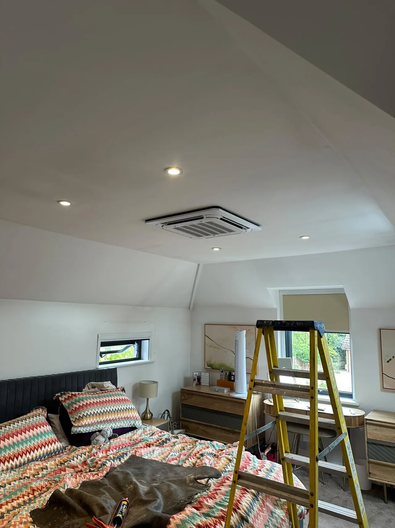 Ceiling cassette air conditioning unit installed in a bedroom